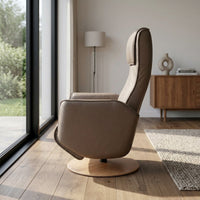Orla Riser Recliner Swivel Chair on a circular wooden base, side view.