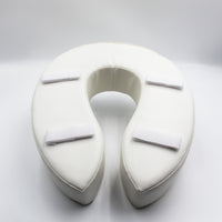 U-shaped padded raised toilet seat with four Velcro straps and soft cushion, front view.