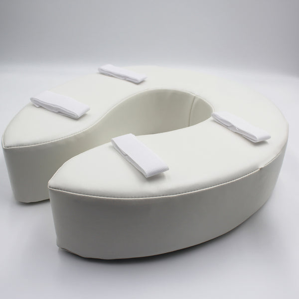 Homecraft Padded Raised Toilet Seat with soft horseshoe shape and four straps for secure fitting, top view.