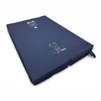 Harvest Healthcare Partnership Active Mattress with white icons, foot outlines and alternating cells, side view.