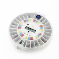 Pivotell Advance automatic pill dispenser with labelled compartments, close-up front view.