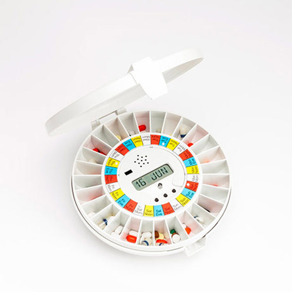Pivotell Advance Automatic Pill Dispenser with round labelled compartments and digital display, front view.