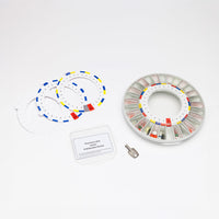Pivotell Mk3 Automatic Pill Dispenser with labels, spare disks, metal key and clear lid, front view.