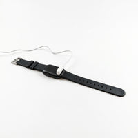 Pivotell Vibratime Smart Watch charging with reminder display, used for alerts and routine management, close-up view.