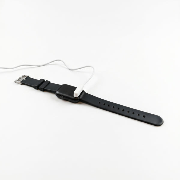 Pivotell Vibratime Smart Watch charging with reminder display, used for alerts and routine management, close-up view.