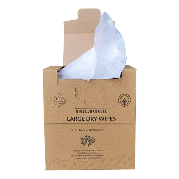 Box labeled Nilaqua Plastic Free Large Dry Wipes with a white wipe beside it, biodegradable and plastic-free, front view.