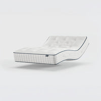 Opera Beds Premium Natural Pocket 2500 Mattress with dark edging, bent and floating over a plain white background, angled view.