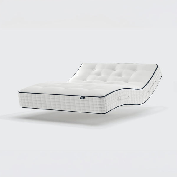 Opera Beds Premium Natural Pocket 2500 Mattress with tufting and pocket springs shown bending at an angle, side view.