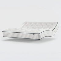Opera Beds Premium Natural Pocket 2500 Mattress with tufted surface, reclined on plain background, angled side view.