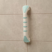 Gordon Ellis Prima Straight Grab Bar mounted vertically on beige tiled wall, front view.