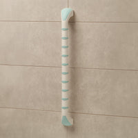 Gordon Ellis Prima Straight Grab Bar with non-slip grip mounted vertically on a tiled bathroom wall, front view.