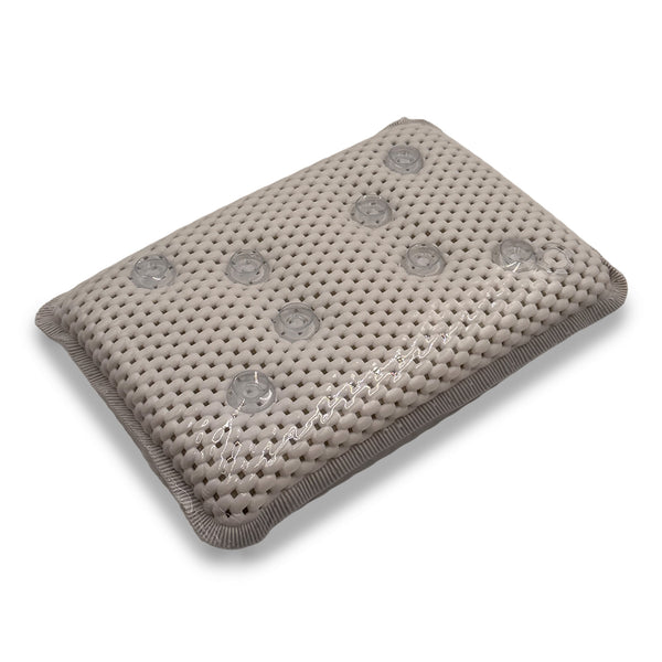 PVC foam bath pillow with suction cups for secure positioning, designed for use in the bath, close-up view.