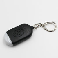 Lifemax Rechargeable Personal Alarm keychain with torch, speaker grill, and metal ring on plain background, front view.