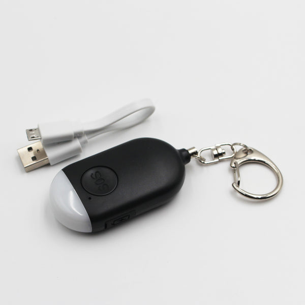Lifemax Rechargeable Personal Alarm keyring with torch and USB cable on white surface, top view.