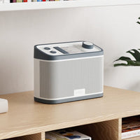 Grey Relish Radio on a bookshelf, designed for people with dementia