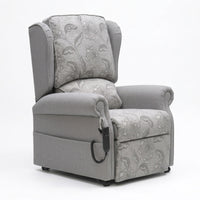 Repose Westbury dual motor riser recliner chair with floral fabric, split back and wired remote, front view.