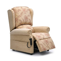 Westbury dual motor riser recliner chair with raised footrest and wired remote on armrest, front angle view.