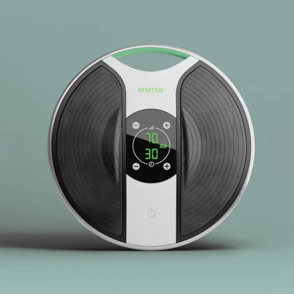 Revitive New Medic round device with digital display, foot pads and touch buttons for muscle stimulation, front view.