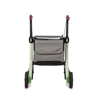 Mint green carbon fibre rollator with black handles and large grey storage bag, rear view.