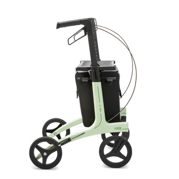 Mint green carbon fibre rollator with four black wheels, seat and black storage bag, side view.