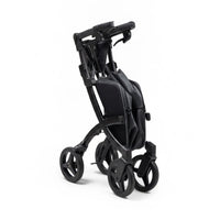 Rollz Flex 2-in-1 rollator and shopping trolley folded on four wheels, white background, side view.