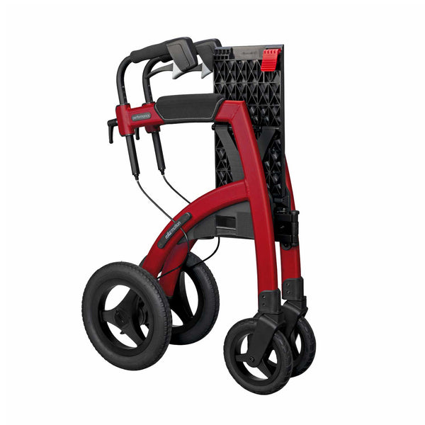 Ruby Red Rollz Motion Performance all-terrain rollator and wheelchair folded upright for storage, side view.