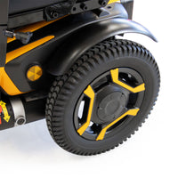 Roma P400 Powerchair rear wheel with rugged tyre and geometric spokes, close-up.