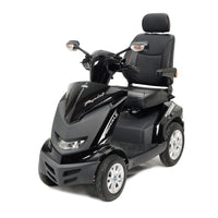 Drive Royale 4 Scooter with four wheels, adjustable seat, armrests and dual rear-view mirrors, front angled view.