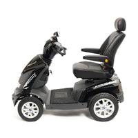 Drive Royale 4 Scooter with adjustable padded seat, armrests, headrest and four wheels, side view.