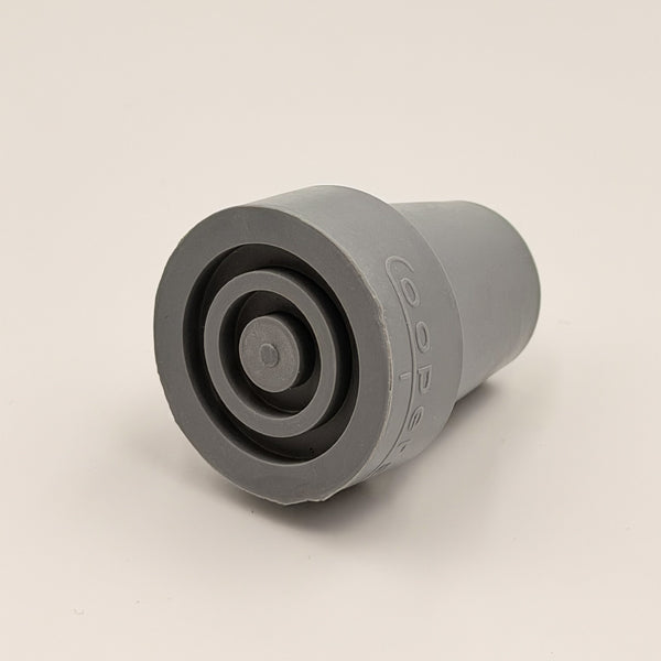 Coopers walking stick ferrule, cylindrical metal with flat face and raised centre for walking aids, close-up view.