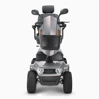 Drive Safari Scooter with all-round suspension, four pneumatic tyres, basket, handlebars and padded headrest, front view.
