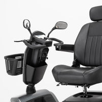 Drive Safari Scooter with all-round suspension, armrests, pneumatic tyres, basket and rearview mirrors, front angle view.