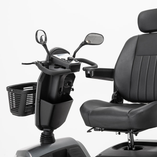 Drive Safari Scooter with all-round suspension, armrests, pneumatic tyres, basket and rearview mirrors, front angle view.