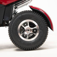 Drive Safari Scooter large pneumatic tyre with silver alloy wheel, white background, close-up.