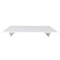 Bath board with four reinforced slats and two triangular support brackets, resting across bathtub, angled side view.