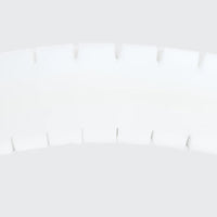 Curved row of interlocking segments from the Opera Beds Serene Profiling Mattress on a plain background, angled view.