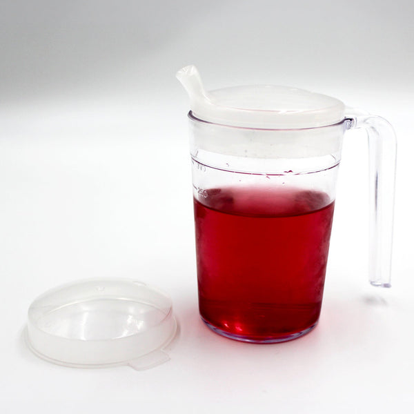Homecraft shatterproof mug with handle, anti-spill spout lid, spare clear lid, filled with liquid, front view.