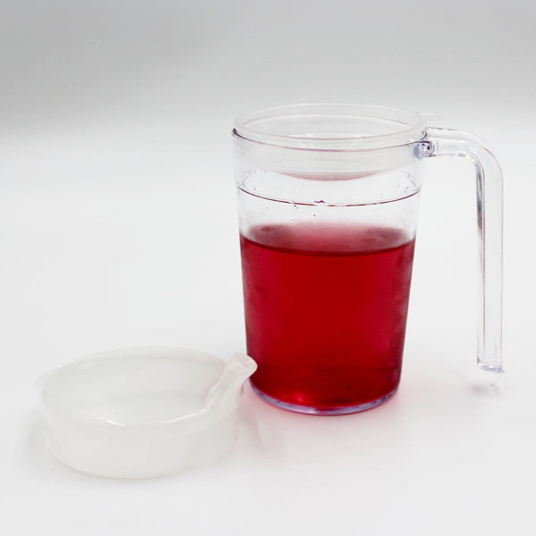 Homecraft Shatterproof Mug with liquid on a white surface next to its anti-spill lid, front view.
