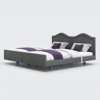 Opera Beds Signature Comfort Dual Profiling Bed with two headboards and white bedding with purple accents, front view.