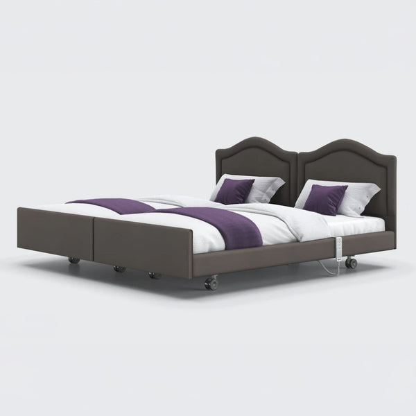 Pair of Opera Beds Signature Comfort Dual Profiling beds side by side with white bedding and purple accents, front view.
