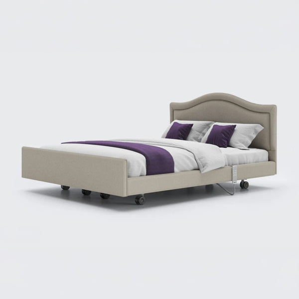 Opera Beds Signature Comfort Dual Profiling Bed with wavy headboard and castors, plain background, front view.