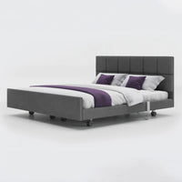 Opera Beds Signature Comfort Dual Profiling Bed with white bedding and purple accents, plain white background, front view.