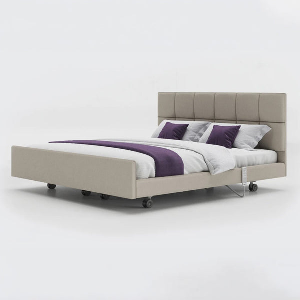 Opera Beds Signature Comfort Dual Profiling Bed with tufted headboard, white bedding, wheels; front view.