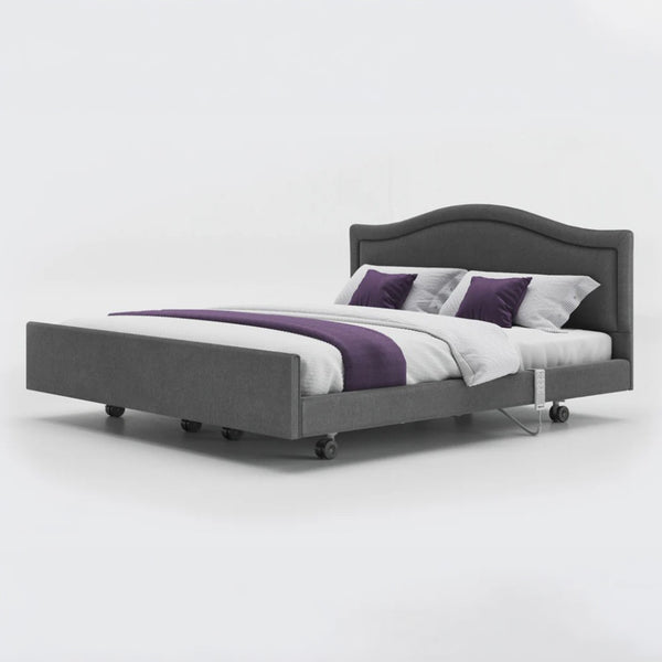 Opera Beds Signature Comfort Dual Profiling Bed with curved headboard and white bedding, front view.