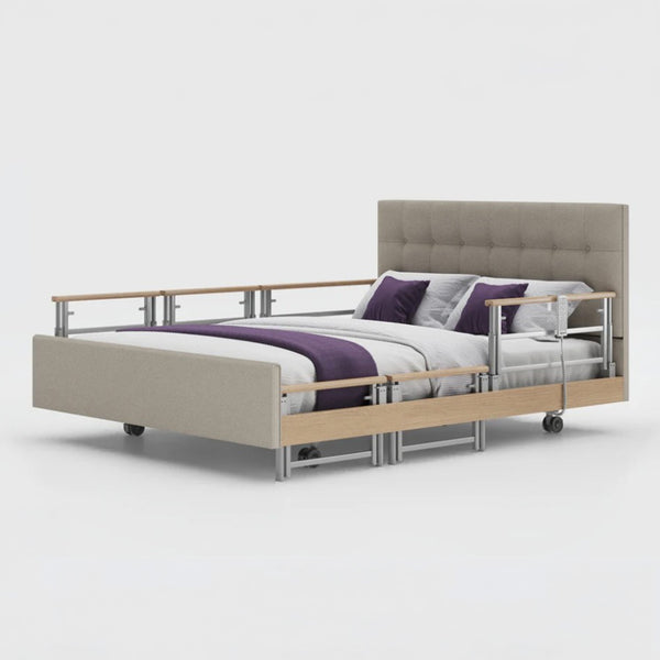 Opera Beds Signature Comfort Plus Dual Profiling Bed with linen upholstery, drop side rails and white bedding, purple accents, front view.