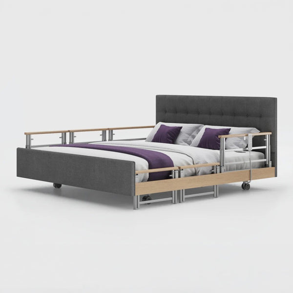 Opera Beds Signature Comfort Plus Dual Profiling Bed with adjustable rails, purple and white bedding, side view.