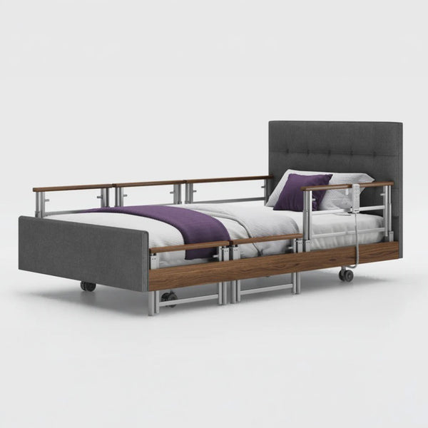 Opera Beds Signature Comfort Plus Profiling Bed with adjustable rails and white bedding on a white background, front view.