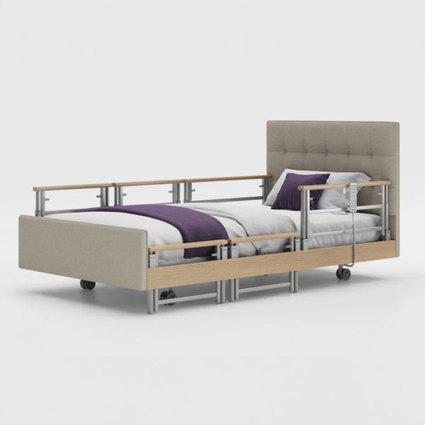 Opera Beds Signature Comfort Plus Profiling Bed with adjustable side rails, white bedding and purple blanket, side view.