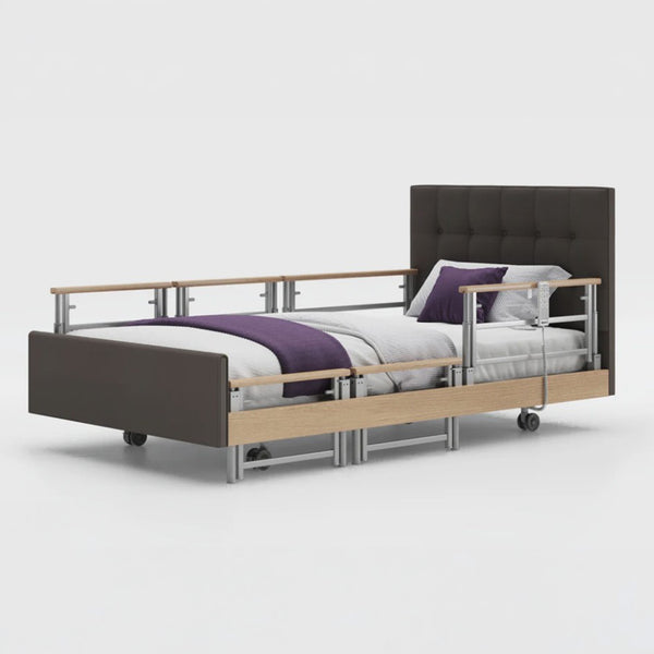 Opera Beds Signature Comfort Plus Profiling Bed with adjustable rails, leatherette frame and white bedding, side view.