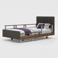 Signature Comfort Plus Profiling Bed by Opera Beds with leatherette frame, side rail, white bedding and purple blanket, front view.